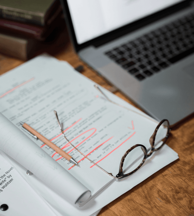 document on table with glasses