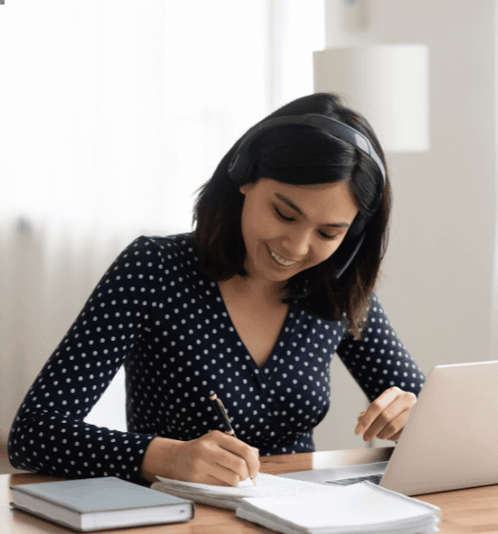 woman writing on several documents