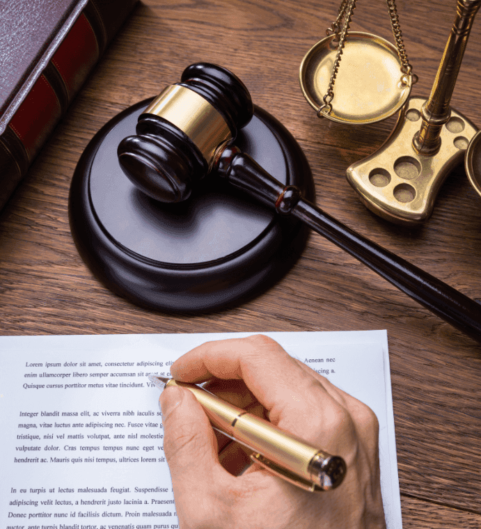 man signing a legal document